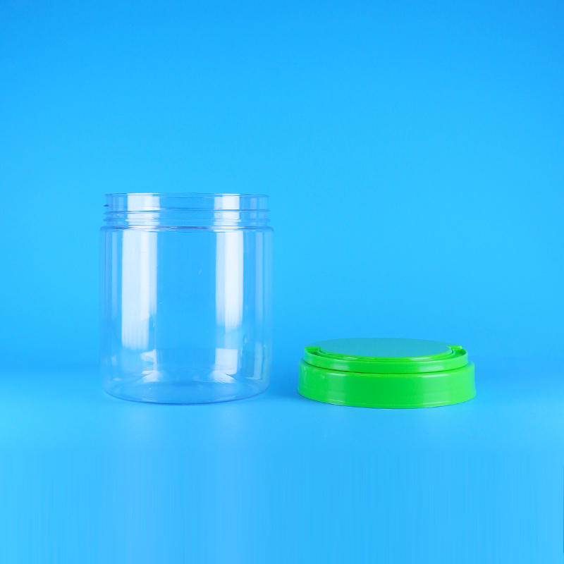 برطمان زبدة الفول السوداني البلاستيكي الشفاف المستدير الفارغ القابل للإغلاق بغطاء بمقبض لولبي وخالٍ من مادة BPA